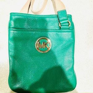 Green leather Michael Kors cross body purse.